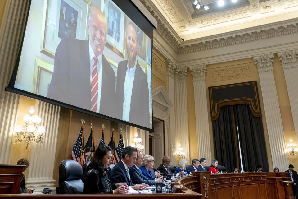 FILE - An image of former President Donald Trump and Brad Parscale, former campaign manager for President Donald Trump, is displayed during a House select committee hearing investigating the Jan. 6 attack on the U.S. Capitol, on Capitol Hill in Washington, Thursday, Oct. 13, 2022. In a text to a former campaign colleague, Parscale wrote he felt “guilty for helping” Trump win after the Jan. 6 riots. (AP Photo/Andrew Harnik, Pool, File)