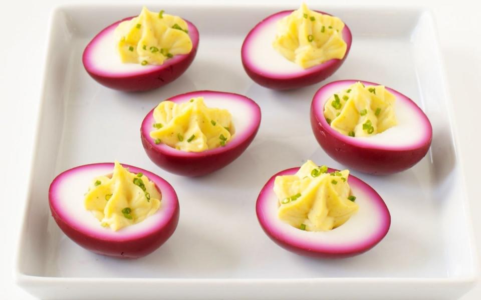 <p>Tina Rupp</p><p>A dip in beet pickling liquid gives these snacks their pretty color.</p><p><strong>Get the recipe: <a href="https://parade.com/19416/dash/beet-pickled-deviled-eggs/" rel="nofollow noopener" target="_blank" data-ylk="slk:Beet Pickled Deviled Eggs;elm:context_link;itc:0;sec:content-canvas" class="link ">Beet Pickled Deviled Eggs</a></strong></p>