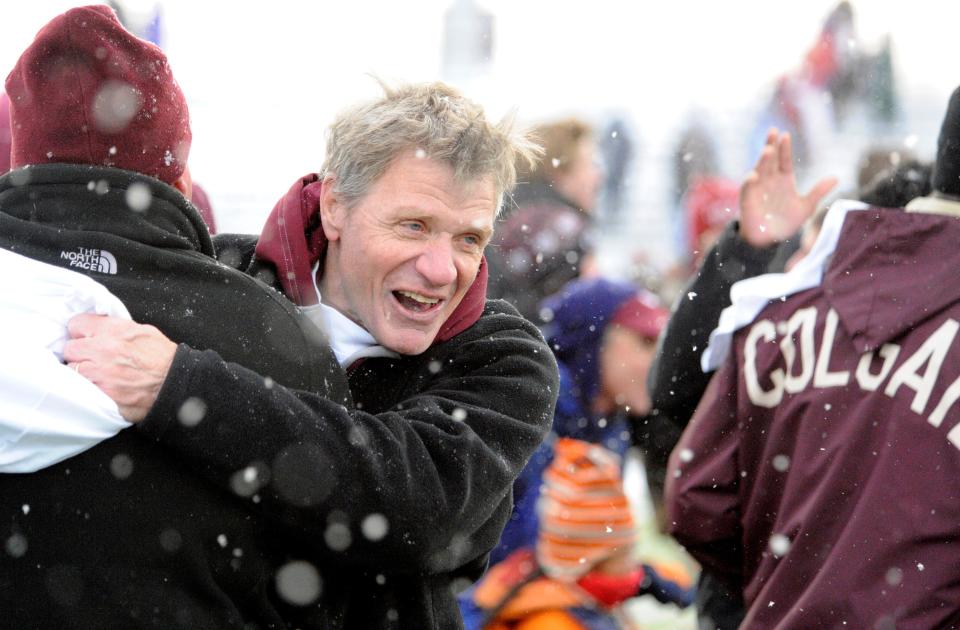 Dick Biddle celebrates on the Colgate University sideline following a victory. Biddle, Colgate's winnegest football coach, died Aug. 11.