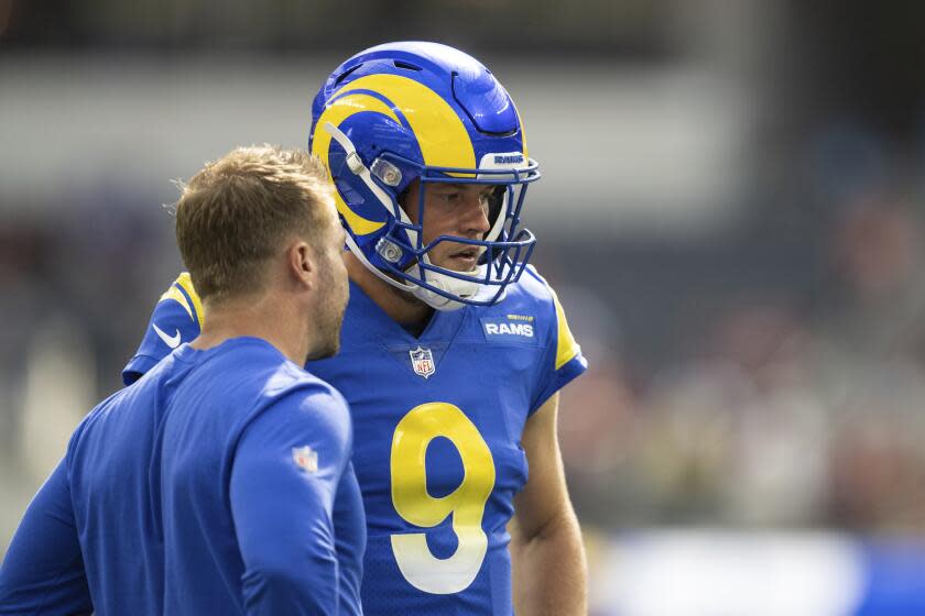 Los Angeles Rams quarterback Matthew Stafford (9) talks to Los Angeles Rams head coach Sean McVay.