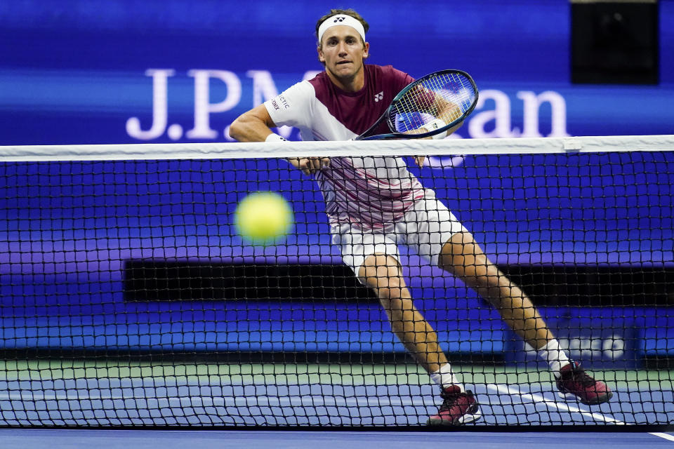 Casper Ruud, of Norway, comes to the net against Carlos Alcaraz, of Spain, during the men's singles final of the U.S. Open tennis championships, Sunday, Sept. 11, 2022, in New York. (AP Photo/Matt Rourke)