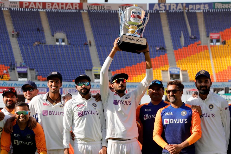 Axar Patel of India raising high the series trophy (BCCI)