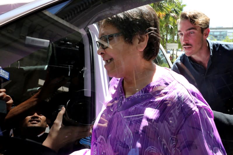 Australian Maria Elvira Pinto Exposto enters a car following her acquiting at the Federal Court in Putrajaya