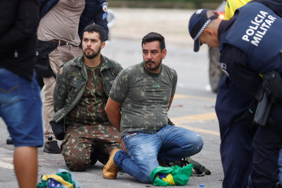 Security forces detain supporters of Brazil's former President Jair Bolsonaro.