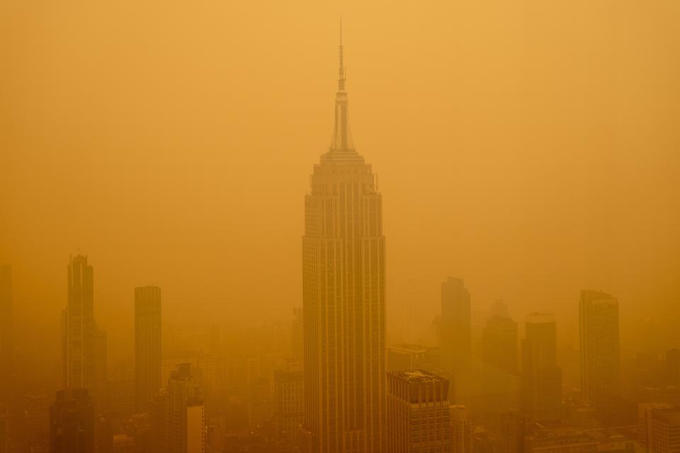 Smoky haze from wildfires in Canada diminishes the visibility of the Empire State Building on Wednesday in New York City.