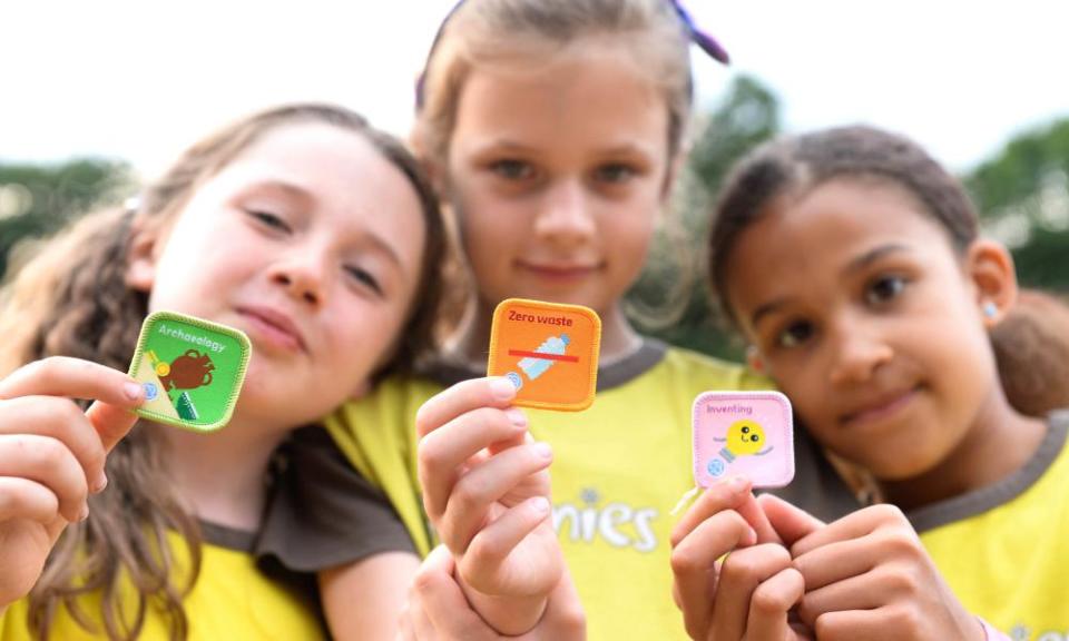 Guides and Brownies from the 22nd Walthamstow unit in London reveal three of the new badges.