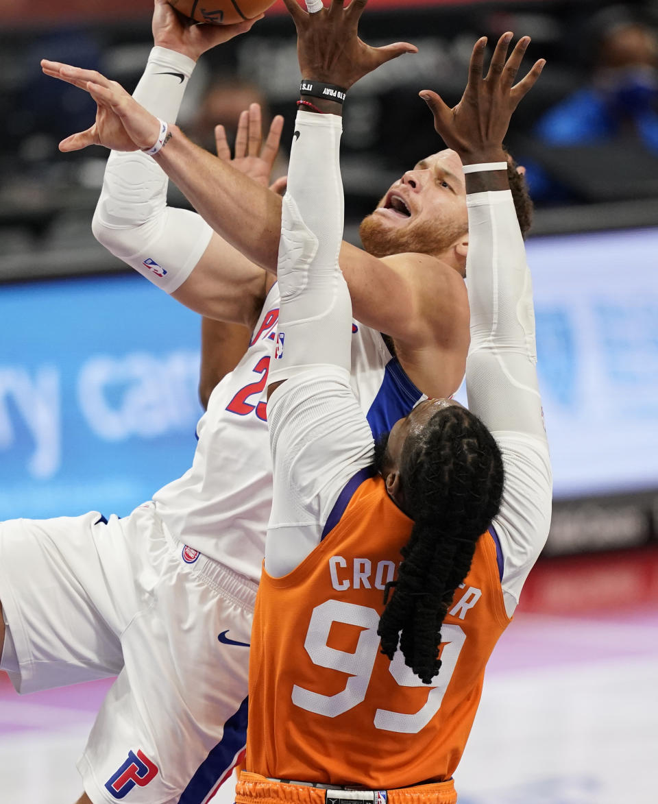 Detroit Pistons forward Blake Griffin (23) attempts a layup as Phoenix Suns forward Jae Crowder (99) defends during the second half of an NBA basketball game, Friday, Jan. 8, 2021, in Detroit. (AP Photo/Carlos Osorio)