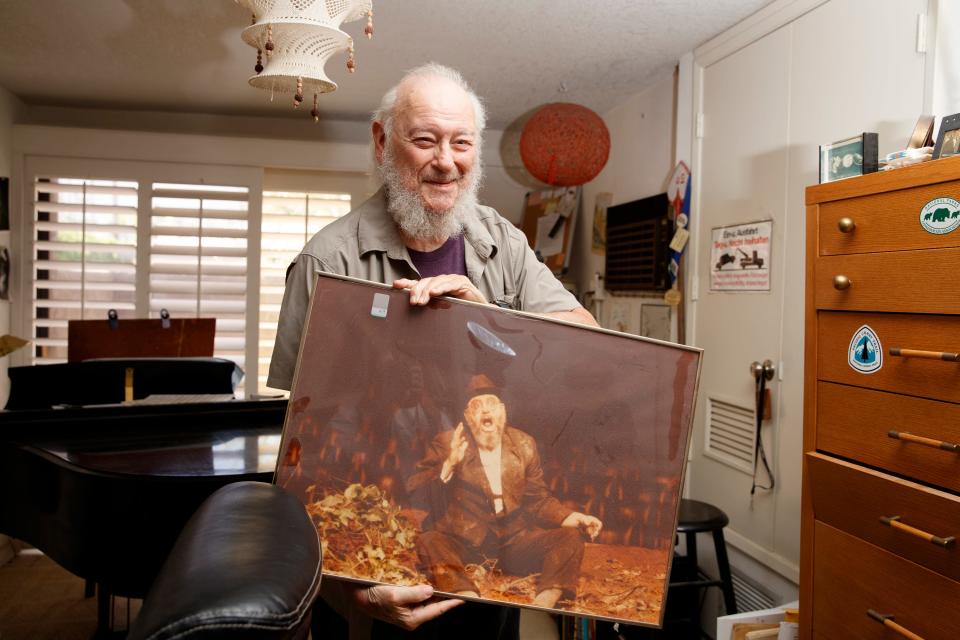 Composer Stanley Walden holds a photograph of himself taken during an acting performance inside his home in Palm Springs, Calif., on August 1, 2022. 