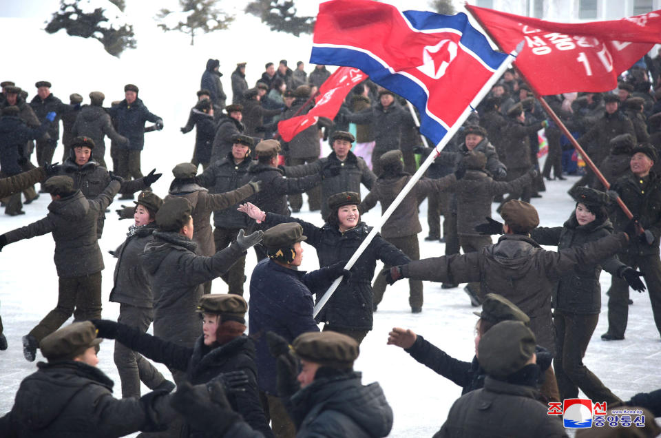 People dance during a ceremony celebrating the completion of township of Samjiyon County, North Korea, in this undated picture released by North Korea's Central News Agency (KCNA) on December 2, 2019. KCNA via REUTERS – THIS IMAGE WAS PROVIDED BY A THIRD PARTY. REUTERS IS UNABLE TO INDEPENDENTLY VERIFY THIS IMAGE.