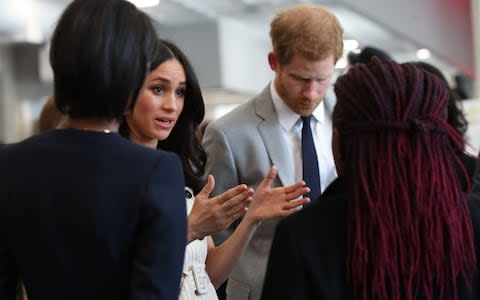 Prince Harry and Meghan Markle (both centre) talk with delegates during a reception - Credit: Yui Mok /PA