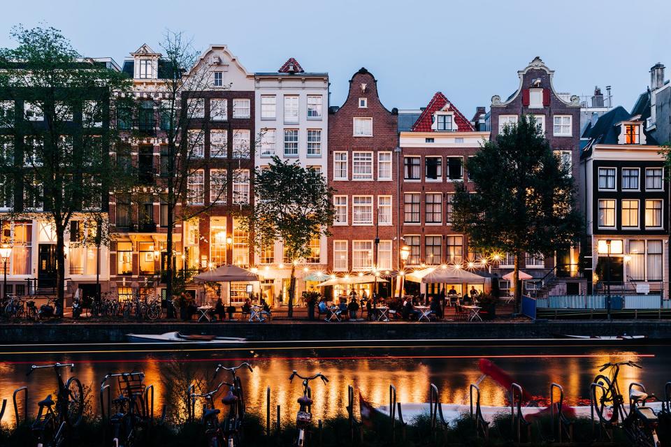 A night-time view of a cafe / street scene in Amsterdam