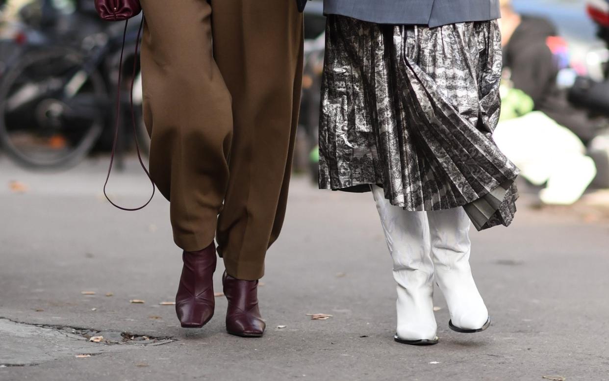 Knee-high and white styles are both trending this winter.  - Getty Images Europe