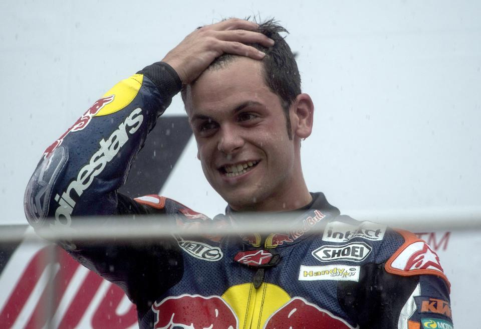 KUALA LUMPUR, MALAYSIA - OCTOBER 21: Sandro Cortese of Germany and Red Bull KTM Ajo celebrates on the podium after victory in the Moto3 race, sealing victory in the Moto3 Championship, during the MotoGP Of Malaysia at Sepang Circuit on October 21, 2012 in Kuala Lumpur, Malaysia. (Photo by Mirco Lazzari gp/Getty Images)