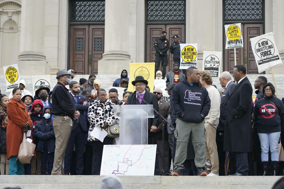 FILE - People gather on the steps of the Mississippi Capitol in Jackson, Jan. 31, 2023, during a protest. A lawsuit filed Friday, June 2, 2023, challenges a new Mississippi law that will require people to receive state law enforcement permission before protests near state government buildings in Jackson. (AP Photo/Rogelio V. Solis, File)