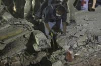 <p>Rescue workers search for people trapped in a collapsed building in the Piedad Narvarte neighborhood of Mexico City, Tuesday, Sept. 19, 2017. A magnitude 7.1 earthquake has stunned central Mexico, killing more than 100 people as buildings collapsed in plumes of dust. Thousands fled into the streets in panic, and many stayed to help rescue those trapped. (AP Photo/Rebecca Blackwell) </p>