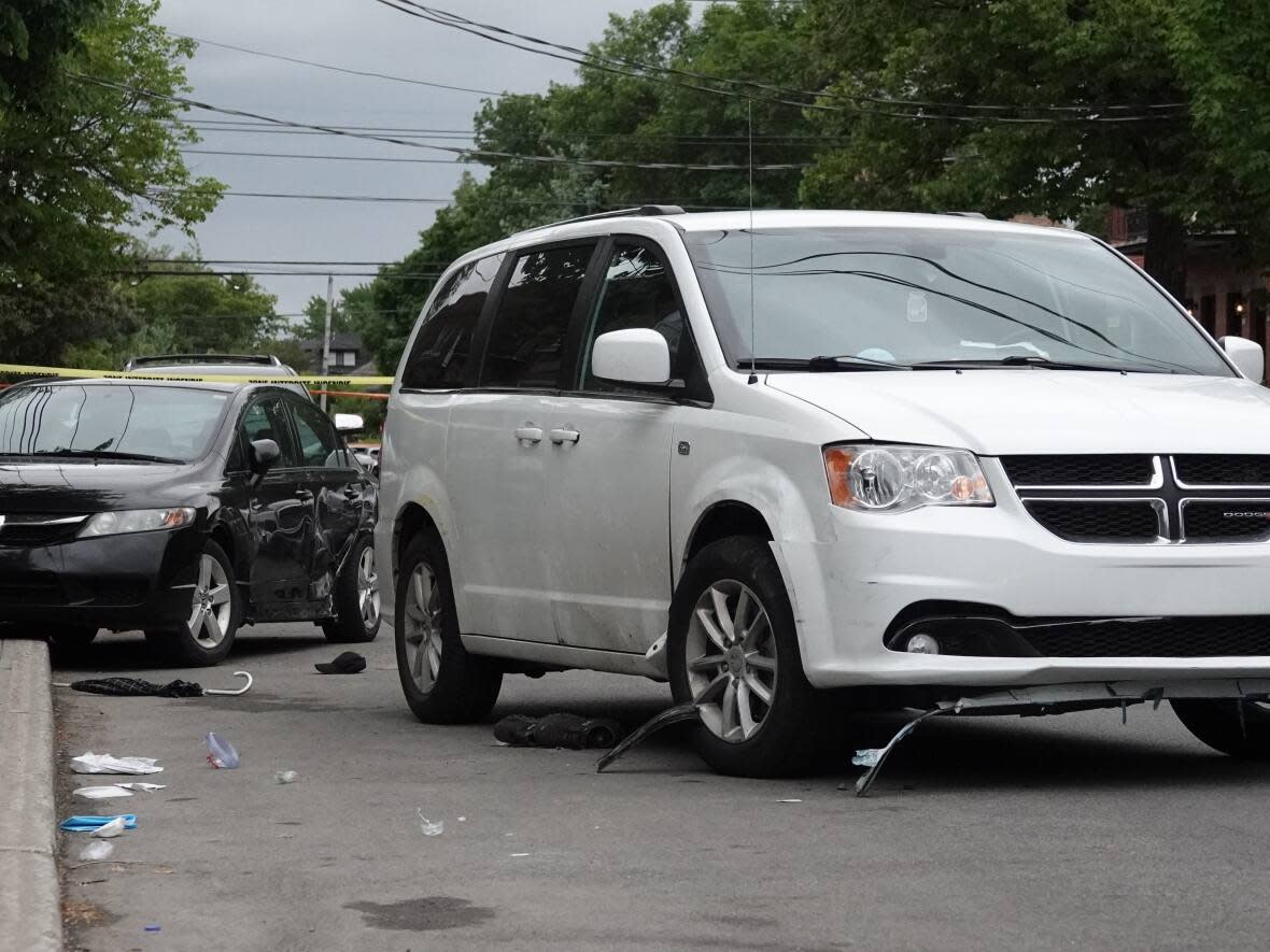 The driver of the minivan struck a parked car for unknown reasons before hitting two pedestrians, according to Montreal police. (Kolya Hubacek-Guilbault/Radio-Canada - image credit)