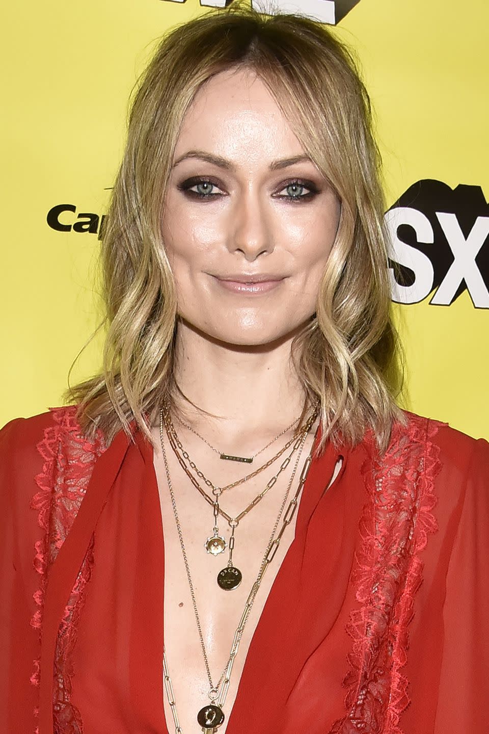 <p>A half up half down style doesn't have to look so structured. Wear it more casual by gathering hair loosely at the back like Olivia Wilde. </p>