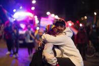 A couple embraces during the Diversity parade in Montevideo, Uruguay, Friday, Sept. 25, 2020. The event is held every year to raise awareness and fight discrimination based on sexual identity and orientation. (AP Photo/Matilde Campodonico)