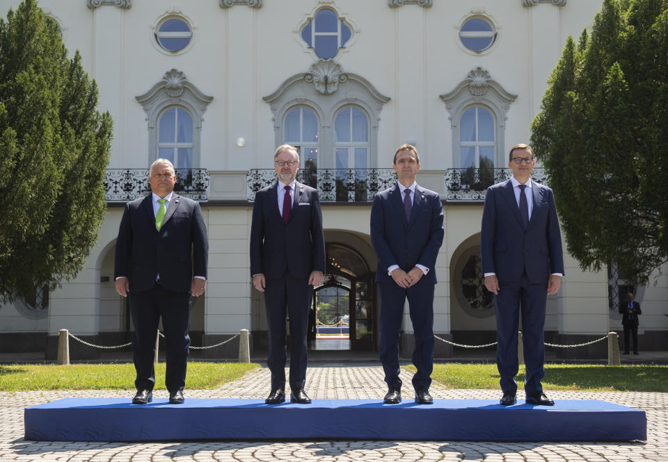 From left, Hungary's Prime Minister Viktor Orban, Czech Republic's Prime Minister Petr Fiala, Slovakia's Prime Minister L'udovít Odor and Poland's Prime Minister Mateusz Morawiecki pose for the media during the V4 summit in Bratislava, Slovakia, Monday, June 26, 2023. The leaders of four Central European countries are emphasizing issues that tie them together and downplaying those that have caused divisions during a summit of regional prime ministers in Slovakia. (Martin Baumann/TASR via AP)