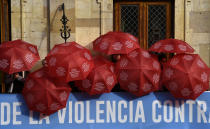 <p>People are covered with red umbrellas to commemorate the victims of gender violence during the UN International Day for the Elimination of Violence against Women in Oviedo, northern Spain, on Nov. 25, 2017. (Photo: Eloy Alonso/Reuters) </p>