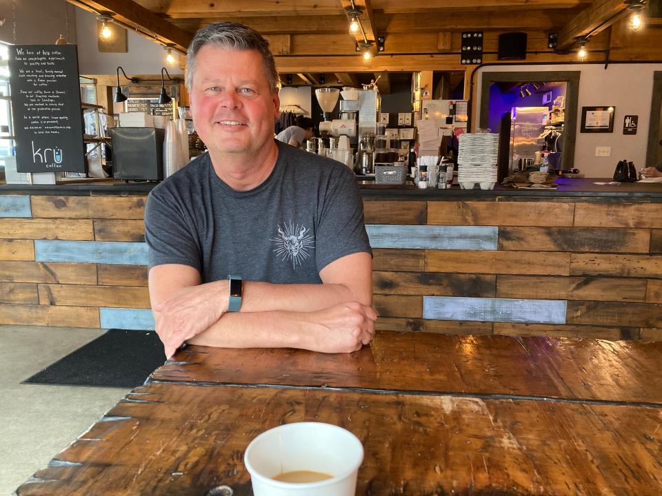 Kyle Brock, co-owner of Kru Coffee, sits April 14, 2022 at the shop in Saratoga Springs, New York.