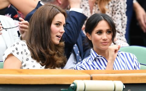 Catherine, Duchess of Cambridge and Meghan, Duchess of Sussex at Wimbledon - Credit: Clive Mason/Getty Images