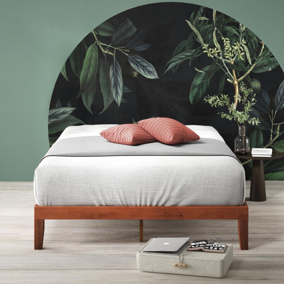 the wooden platform bed in a bedroom