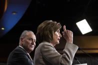 House Speaker Nancy Pelosi of Calif., right, joined by Senate Minority Leader Chuck Schumer of N.Y., speaks during a news conference, on Capitol Hill, Tuesday, Feb.11, 2020, in Washington. (AP Photo/Alex Brandon)