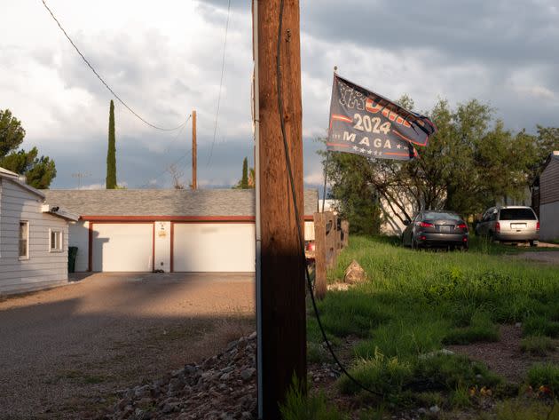 Fading and frayed, a Trump 2024 flag flies outside a residence in Tombstone. (Photo: Molly Peters for HuffPost)