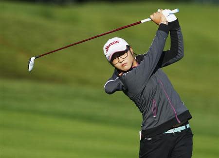 Lydia Ko of New Zealand hits an approach shot onto the 15th hole during the first round of the women's Evian Championship golf tournament in Evian September 13, 2013. REUTERS/Denis Balibouse