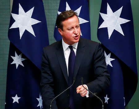 British Prime Minister David Cameron addresses a joint session of the Australian Parliament in Canberra November 14, 2014. REUTERS/David Gray