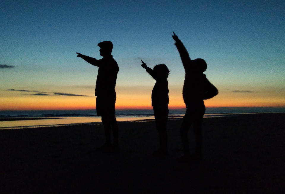 Dad Danny on the left, Edith in the middle and Clarence on the right, stargazing while on their van adventure. (Caters)