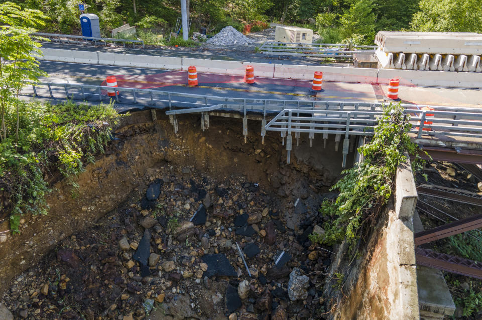 Erosion damage is seen after heavy rains washed down Bear Mountain near the Popolopen Bridge along U.S. Route 9W in Highland Falls, N.Y., rendering the bridge unsafe and impassable for vehicles, on Monday, July 10, 2023. (AP Photo/Ted Shaffrey)