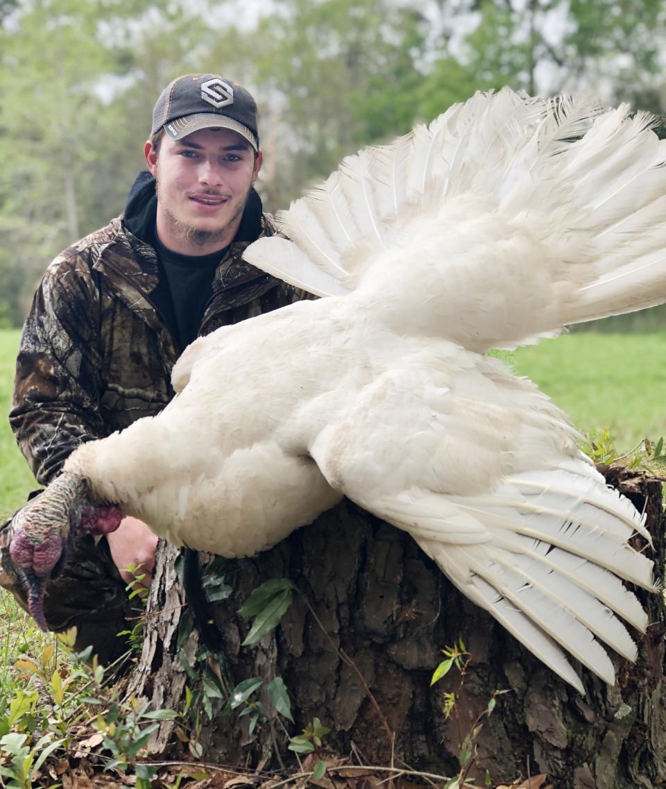 Hunter Waltman of Kiln harvested a white turkey in 2019 and made national news.
