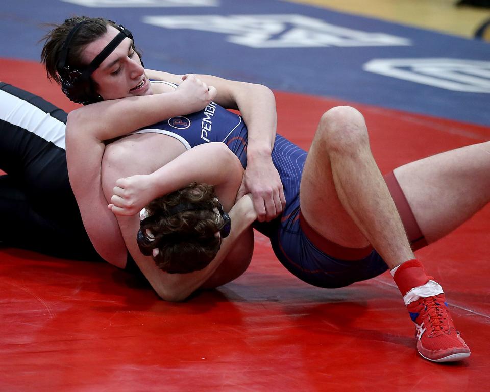 Pembroke’s Logan Callahan (182 lbs) has a hold of Plymouth South’s Michael Caruso in their match at Pembroke High on Wednesday, Jan. 25, 2023. 