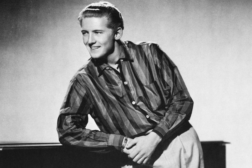 Portrait of pianist and singer Jerry Lee Lewis leaning on a piano. (Photo by �� John Springer Collection/CORBIS/Corbis via Getty Images)