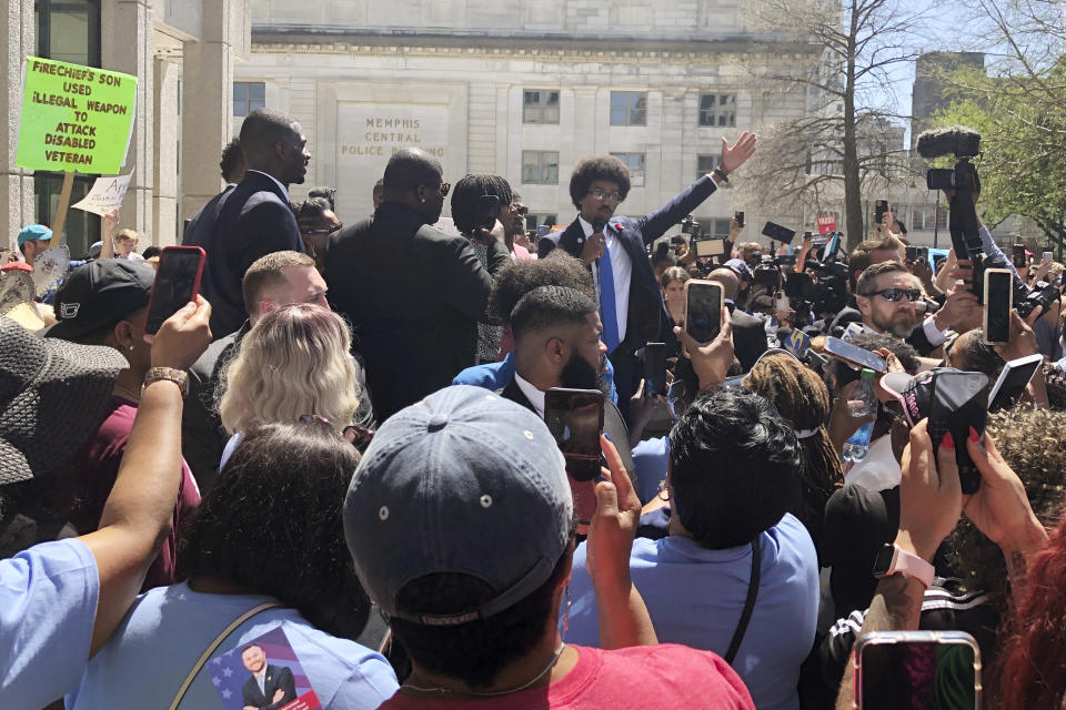 Justin Pearson celebrates with supporters after being reinstated to the the Tennessee House of Representatives by the Shelby County Board of Commissioners building in Memphis, Tenn., on Wednesday, April 12, 2023. Republicans expelled Pearson and Rep. Justin Jones last week over their role in a gun control protest on the House floor after a Nashville school shooting that left three children and three adults dead. (AP Photo/Adrian Sainz)