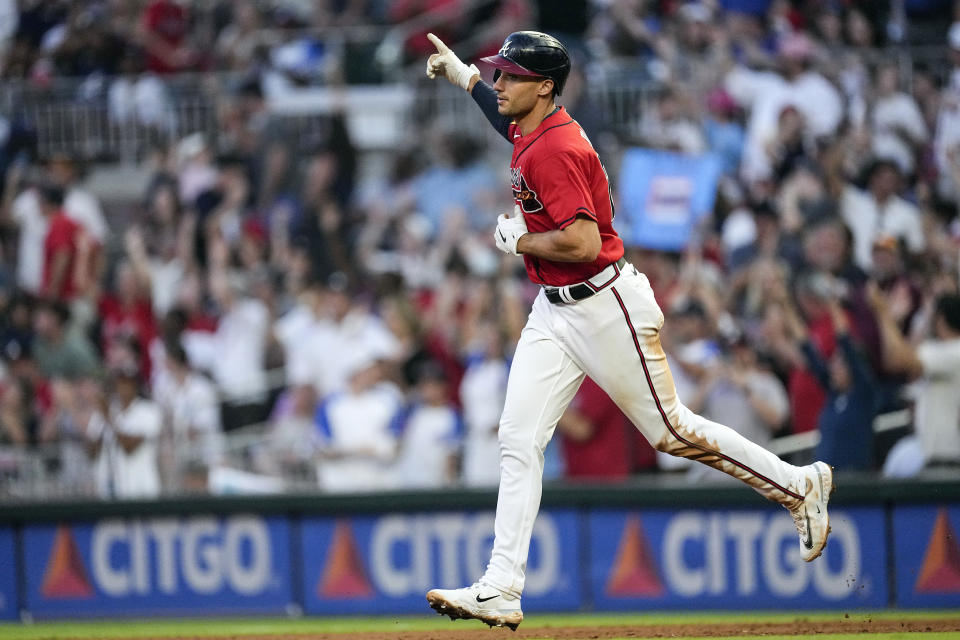 Atlanta Braves' Matt Olson gestures as he runs the bases after hitting a two-run home run against the Miami Marlins during the fifth inning of a baseball game Friday, June 30, 2023, in Atlanta. (AP Photo/John Bazemore)