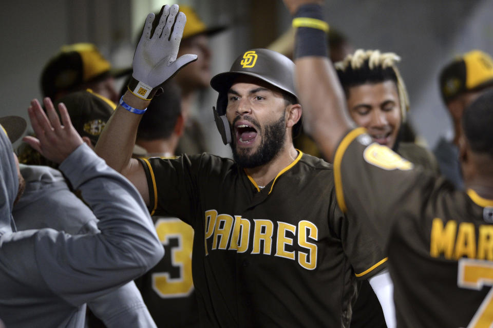 FILE - San Diego Padres' Eric Hosmer is congratulated in the dugout after hitting a home run during the sixth inning of the team's baseball game against the St. Louis Cardinals on Friday, June 28, 2019, in San Diego. Hosmer announced his retirement from baseball Wednesday, Feb. 21, 2024, following a 13-year career that included winning four Gold Gloves and helping lead Kansas City to victory in the 2015 World Series. (AP Photo/Orlando Ramirez, File)