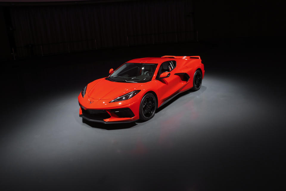 This June 24, 2019, photo shows a pre-production 2020 Chevrolet Corvette automobile in Warren, Mich. The mid-engine C8, the flagship of GM's Chevrolet brand, will have the weight balance and center of gravity of a race car, rivaling European counterparts and leaving behind sports sedans and ever-more-powerful muscle cars that were getting close to outperforming the current 'Vette. (AP Photo/Paul Sancya)