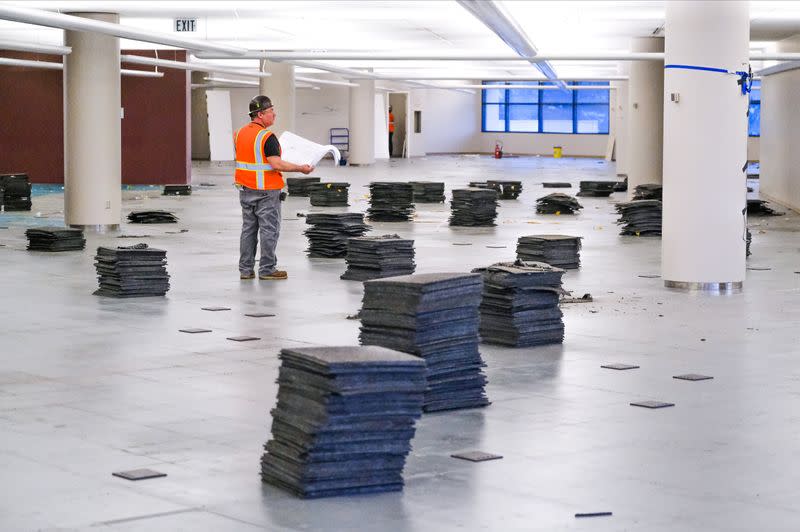 A worker stands inside the GM Kokomo, Indiana building that General Motors and Ventec Life Systems are converting into use for the production of Ventec ventilators in response to the spread of the coronavirus disease