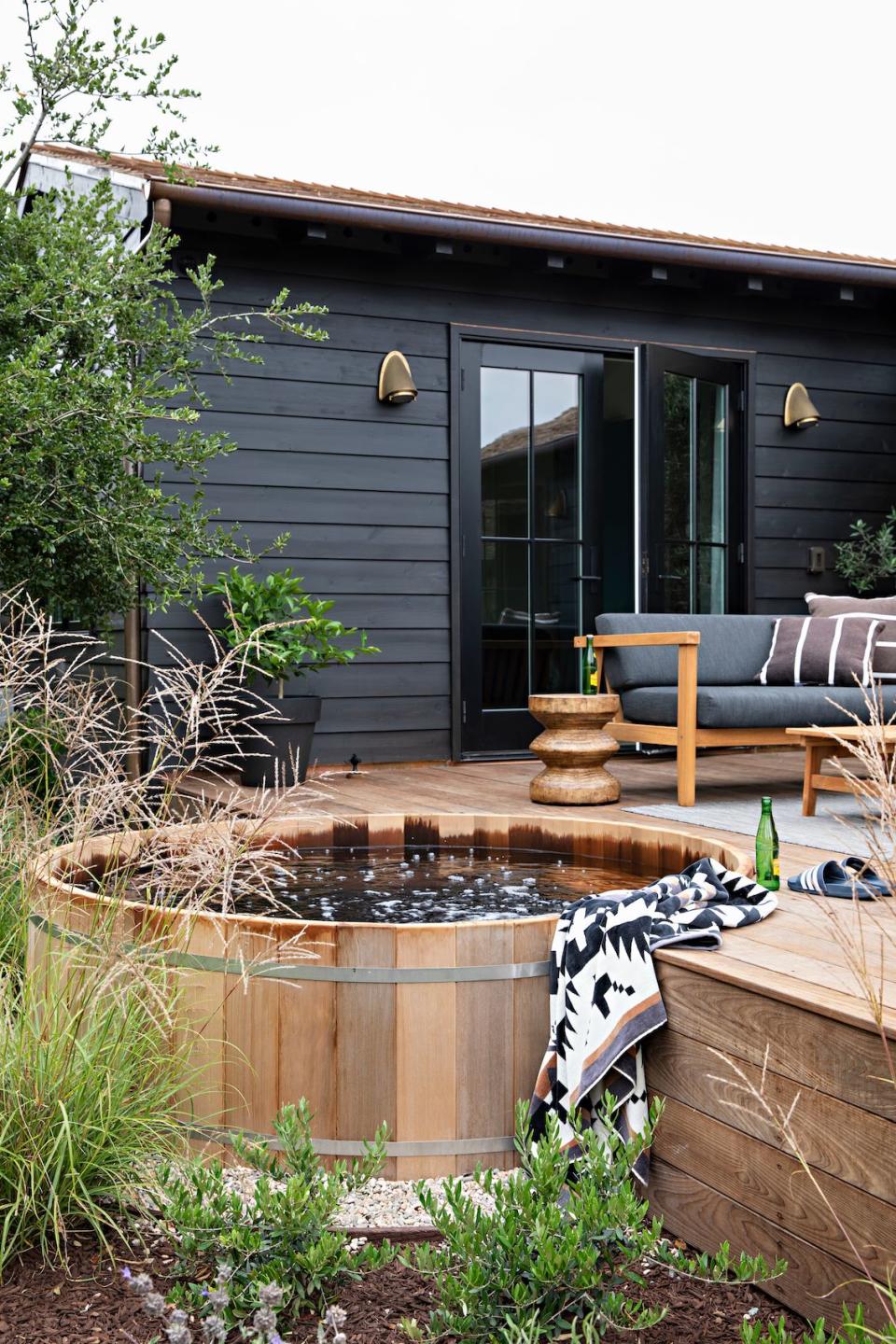 An outdoor space with a hot tub