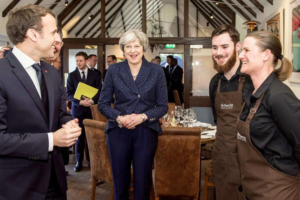 Prime Minister Theresa May and French President Emmanuel Macron during a visit to The Royal Oak in Paley Street, Maidenhead (@Number10gov/PA )