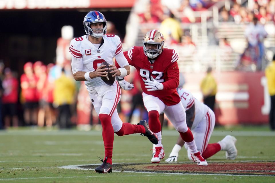 Sep 21, 2023; Santa Clara, California, USA; New York Giants quarterback Daniel Jones (8) runs with the ball ahead of San Francisco 49ers defensive end Kerry Hyder Jr. (92) in the first quarter at Levi's Stadium. Mandatory Credit: Cary Edmondson-USA TODAY Sports