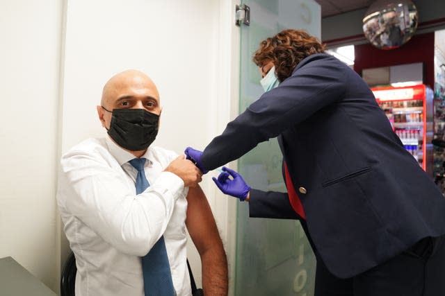 Health Secretary Sajid Javid receives his Covid-19 booster jab from Nikki Kanani, Medical director primary care NHS England, at a pharmacy in central London (PA)