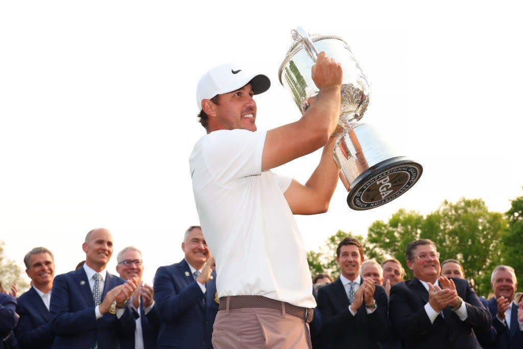 Brooks Koepka celebrates on the 18th green at Oak Hill (Getty Images)