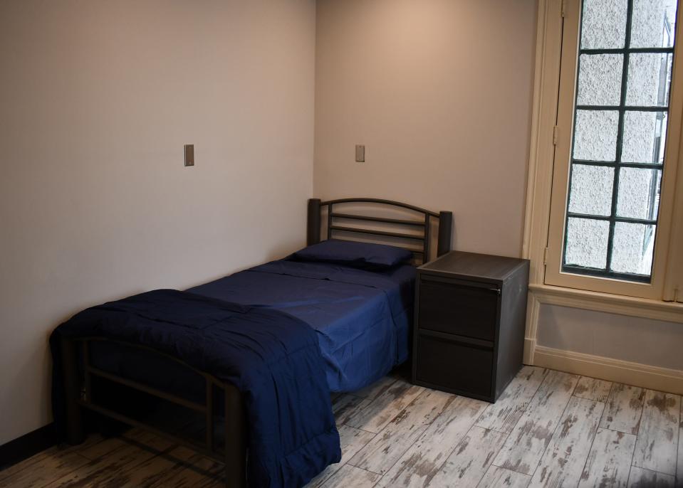 One of the 16 upstairs rooms at Birchard Place includes a dresser and bed.