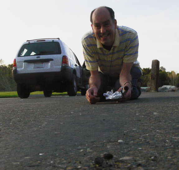 NASA Ames and SETI Institute meteor astronomer Dr. Peter Jenniskens collects fallen meteorites using aluminum foil, to avoid contaminating the stones by touch.