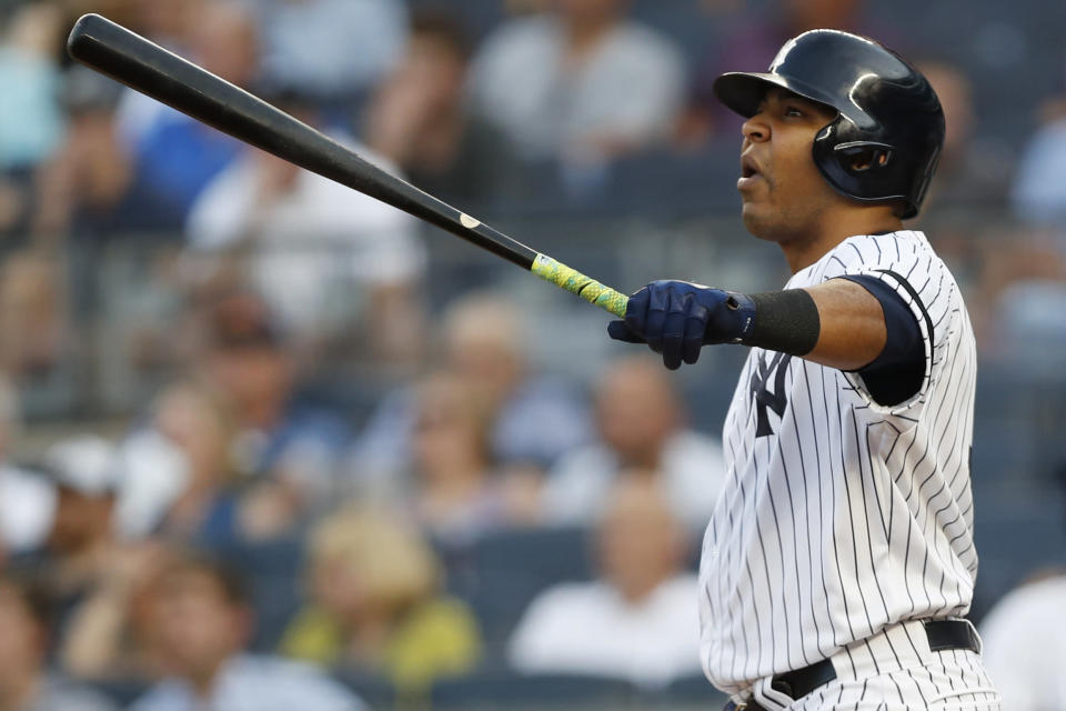 New York Yankees designated hitter Edwin Encarnacion watches his solo home run during the second inning of the team's baseball game against the Tampa Bay Rays, Tuesday, July 16, 2019, in New York. (AP Photo/Kathy Willens)