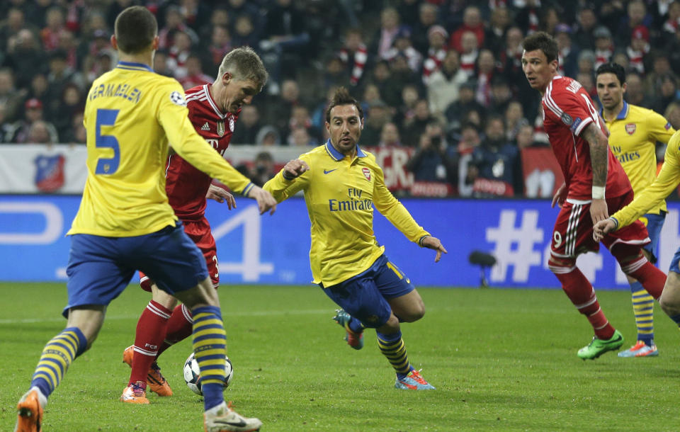 Bayern's Bastian Schweinsteiger, second left, scores the opening goal during the Champions League round of 16 second leg soccer match between FC Bayern Munich and FC Arsenal in Munich, Germany, Wednesday, March 12, 2014. (AP Photo/Matthias Schrader)